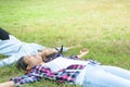 Two Young Woman ,Beautiful girl is relaxing lying on the grass i Royalty Free Stock Photo