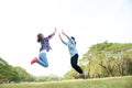 Two Young Woman ,Beautiful girl is relaxing lying on the grass i Royalty Free Stock Photo