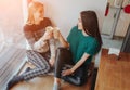 Two young woman chatting in a coffee shop. Two friends enjoying coffee together Royalty Free Stock Photo