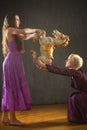 Two young woman dancing with antique carousel horse. Royalty Free Stock Photo