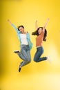 two young woman happy smile jump up celebrate success with raise hands Royalty Free Stock Photo