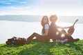 Two young woman sitting on mountain top and contemplating landscape Royalty Free Stock Photo