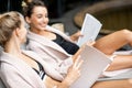 Women relaxing on the sunbeds at the SPA Royalty Free Stock Photo