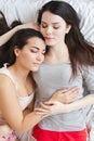 Lesbian couple in bedroom at home lying top view hugging sleeping peaceful Royalty Free Stock Photo