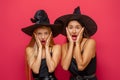 Two young women in black witch costumes Royalty Free Stock Photo