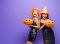 Two young women in black witch costumes Royalty Free Stock Photo