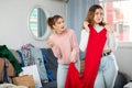 Two young women choosing clothes to wear Royalty Free Stock Photo