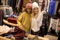 Two young women choosing winter clothes Royalty Free Stock Photo