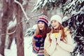 Two young women with colorful cups drinking tea outdoor and smiling Royalty Free Stock Photo