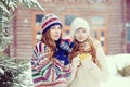 Two young women with colorful cups drinking tea outdoor and smiling Royalty Free Stock Photo