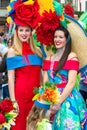 Two young women in colourful costumes at the Flower Festival, Madeira