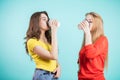 Two young women drinking coffee Royalty Free Stock Photo