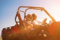 Two young women driving a off road buggy car Royalty Free Stock Photo