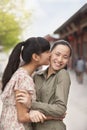 Two young women embracing