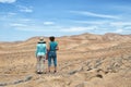 Two young women exploring the desert