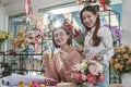 Two young women florist partners with a happy smile in a flower shop. Royalty Free Stock Photo