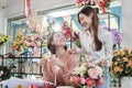 Two young women florist partners with a happy smile in a flower shop. Royalty Free Stock Photo