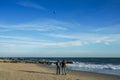 Two young women flying kite at Atlantic beach