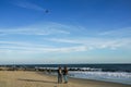 Two young women flying kite at Atlantic beach