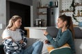 Two young women friends, roommates, business partners and owners of a small business are arguing at home due to the inappropriate Royalty Free Stock Photo
