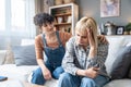 Two young women friends roommates business partners owners of a small business LGBTQ+ lesbian couple arguing at home due to Royalty Free Stock Photo