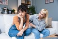 Two young women friends roommates business partners owners of a small business LGBTQ+ lesbian couple arguing at home due to Royalty Free Stock Photo