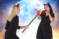 Halloween.Two young woman in Halloween costumes scaring Trident .