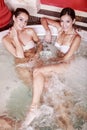 Two young women in the hot tub Royalty Free Stock Photo