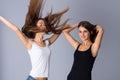 Two young women jumping Royalty Free Stock Photo