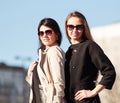 Two young women looking at a tall office building Royalty Free Stock Photo