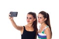 Two young women making selfie
