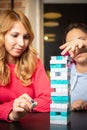 Two young women playing colored jenga