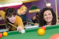 two young women playing pool Royalty Free Stock Photo