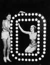 Two young women posing with the letter O Royalty Free Stock Photo