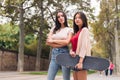 two women posing serious looking at camera