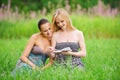 Two young women reading book Royalty Free Stock Photo