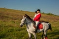 Two young women riding horse in park. Horse walk in summer Royalty Free Stock Photo