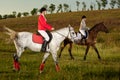 Two young women riding horse in park. Horse walk in summer Royalty Free Stock Photo