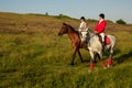 Two young women riding horse in park. Horse walk in summer Royalty Free Stock Photo