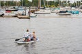 Two young women riding on a paddleboard in the bay Miami FL