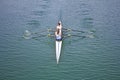 Two young women rowing