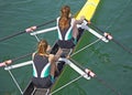 Two young women rowing