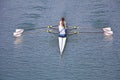 Two young women rowing