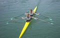 Two young women rowing