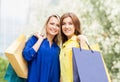 Two young women with shopping bags Royalty Free Stock Photo