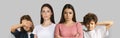 Two Young Women Standing Near Upset Scared Children Over Grey Background Royalty Free Stock Photo