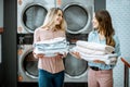 Women with clean clothes in the laundry