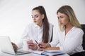 Two young women at a table Royalty Free Stock Photo