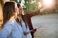 Two young women tourist using their map in the city.