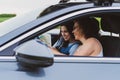 two girls travel the roads in a car, look at the map Vacation concept Royalty Free Stock Photo